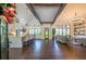 Bright, open-concept living space with wood floors, high ceilings, exposed beams, and a modern kitchen at 23 Sunset Se Rdg, Cartersville, GA 30121