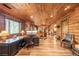 Expansive living room with wood walls, lots of windows, and cozy fireplace at 23 Sunset Se Rdg, Cartersville, GA 30121