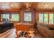 Spacious living room boasts a fireplace, natural wood walls, and hardwood flooring at 23 Sunset Se Rdg, Cartersville, GA 30121