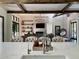 Open-concept design featuring living room with stone fireplace and kitchen with seating at the center island at 23 Sunset Se Rdg, Cartersville, GA 30121