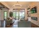 Bright, modern living room with stone accent wall, fireplace, and large glass doors to an outdoor patio at 23 Sunset Se Rdg, Cartersville, GA 30121