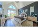 Sun-filled main bedroom with large windows, vaulted ceilings, and elegant decor offers a serene retreat at 23 Sunset Se Rdg, Cartersville, GA 30121