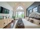 Bright main bedroom with high ceilings, scenic views, and chic décor offers a relaxing atmosphere at 23 Sunset Se Rdg, Cartersville, GA 30121