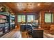 Bright home office boasting wood walls, desk, built-in bookshelves, and picturesque views at 23 Sunset Se Rdg, Cartersville, GA 30121