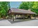 Outdoor pavilion with picnic tables and a stone fireplace for gatherings at 23 Sunset Se Rdg, Cartersville, GA 30121