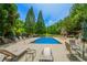 Sparkling community pool with ample seating surrounded by lush greenery at 23 Sunset Se Rdg, Cartersville, GA 30121