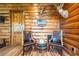 Relax in this cozy sitting area with rustic decor and natural wood walls at 23 Sunset Se Rdg, Cartersville, GA 30121