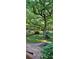 Expansive backyard with lush landscaping, bridge, and wooded views creates a peaceful oasis at 2511 Oak Ave, Tucker, GA 30084
