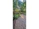 Expansive backyard with lush landscaping, bridge, and wooded views creates a peaceful oasis at 2511 Oak Ave, Tucker, GA 30084