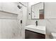 Modern bathroom with walk-in shower, vanity, and stylish tile accents at 2511 Oak Ave, Tucker, GA 30084