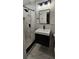 Bathroom features modern fixtures, a walk-in shower, patterned tile accents, and vanity at 2511 Oak Ave, Tucker, GA 30084
