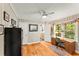 Bright bedroom with hardwood floors, a desk, and a view to the lush outdoors at 2511 Oak Ave, Tucker, GA 30084