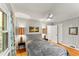 Bedroom features hardwood floors, a ceiling fan, and two windows for natural light at 2511 Oak Ave, Tucker, GA 30084