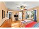 Bright bedroom featuring natural light, hardwood floors, and a ceiling fan at 2511 Oak Ave, Tucker, GA 30084