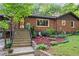 Close-up of a brick home entrance with landscaped garden bed and concrete stairway at 2511 Oak Ave, Tucker, GA 30084