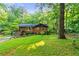 Charming brick home featuring a well-manicured lawn and lush landscaping at 2511 Oak Ave, Tucker, GA 30084