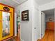 Hallway with hardwood floors and white trim, featuring two doorways at 2511 Oak Ave, Tucker, GA 30084
