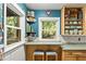 Bright eat-in kitchen with barstool seating, butcher block countertops, and natural light at 2511 Oak Ave, Tucker, GA 30084