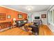 Spacious living room featuring hardwood floors, stylish sofas, and a bright chandelier at 2511 Oak Ave, Tucker, GA 30084