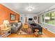 Bright living room featuring hardwood floors, stylish sofas, and a large window at 2511 Oak Ave, Tucker, GA 30084