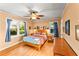 Serene primary bedroom boasts hardwood floors, natural light, and stylish furnishings at 2511 Oak Ave, Tucker, GA 30084