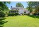 Spacious backyard with a well-manicured lawn and mature landscaping at 5199 Beech Forest Sw Dr, Lilburn, GA 30047