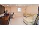 Basement office and sitting area featuring a large L-shaped couch at 5199 Beech Forest Sw Dr, Lilburn, GA 30047