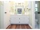 Bathroom featuring a double vanity with white cabinets, providing ample storage space at 5199 Beech Forest Sw Dr, Lilburn, GA 30047