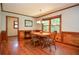 Traditional dining room showcasing hardwood floors, wood trim, and a light fixture at 5199 Beech Forest Sw Dr, Lilburn, GA 30047