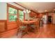 Dining area with hardwood floors, natural light from window, and knotty wood cabinets at 5199 Beech Forest Sw Dr, Lilburn, GA 30047