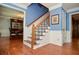 Elegant foyer with hardwood floors, staircase with decorative railings, and access to multiple rooms at 5199 Beech Forest Sw Dr, Lilburn, GA 30047