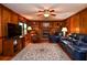 Inviting living room with a brick fireplace, hardwood floors, and leather furniture at 5199 Beech Forest Sw Dr, Lilburn, GA 30047