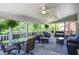 Spacious screened porch with multiple seating areas, perfect for outdoor dining and relaxation at 5199 Beech Forest Sw Dr, Lilburn, GA 30047