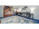 Well-lit study with ample workspace, shelving, and stylish decor at 5199 Beech Forest Sw Dr, Lilburn, GA 30047