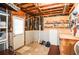 Unfinished basement area with an exterior door and wall-mounted tool rack at 5199 Beech Forest Sw Dr, Lilburn, GA 30047