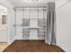 Walk-in closet with lots of shelving and hanging space, along with a second door to another room at 620 Peachtree Ne St # 1716, Atlanta, GA 30308
