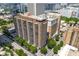 A high-rise condo with balconies, trees, and city surroundings, capturing the building's urban living appeal at 620 Peachtree Ne St # 1716, Atlanta, GA 30308