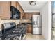 Kitchen with black granite countertops, stainless steel appliances, and overhead lighting at 620 Peachtree Ne St # 1716, Atlanta, GA 30308