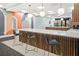 Stylish kitchenette features a marble countertop, wood accents, and barstool seating at 620 Peachtree Ne St # 1716, Atlanta, GA 30308