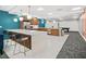 Amenity kitchenette with modern cabinetry, stainless steel appliances, and adjacent lounge area at 620 Peachtree Ne St # 1716, Atlanta, GA 30308