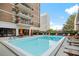 Inviting swimming pool with comfortable loungers and city views at 620 Peachtree Ne St # 1716, Atlanta, GA 30308