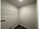 Empty laundry room with white wire shelving at 142 Tye St, Stockbridge, GA 30281