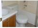 Clean bathroom with a combined shower and tub and classic wood vanity at 230 Happy Valley Church Rd, Dallas, GA 30157