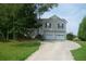 Inviting two-story home with a two-car garage and a long driveway at 230 Happy Valley Church Rd, Dallas, GA 30157