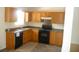 Efficient kitchen with ample cabinet space and black appliances at 230 Happy Valley Church Rd, Dallas, GA 30157