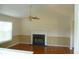 Comfortable living room features a fireplace and a ceiling fan at 230 Happy Valley Church Rd, Dallas, GA 30157