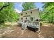 Large backyard with a patio, fire pit, mature trees, and plenty of space for outdoor activities at 3306 Emory Dr, Marietta, GA 30062