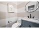 Powder room featuring striped walls and gray vanity with marble countertop at 3306 Emory Dr, Marietta, GA 30062