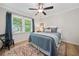 Cozy bedroom with stylish rug, ceiling fan, and natural light at 3306 Emory Dr, Marietta, GA 30062