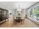Dining room with natural light, wood floors, and antique china cabinet at 3306 Emory Dr, Marietta, GA 30062